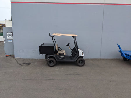 Golf cart equipped with a custom-fabricated CUSH-800-CARGO31-GS HEAVY DUTY LOCKING CARGO BOX FOR CUSHMAN 800 SERIES, designed for secure cargo transport and utility use.