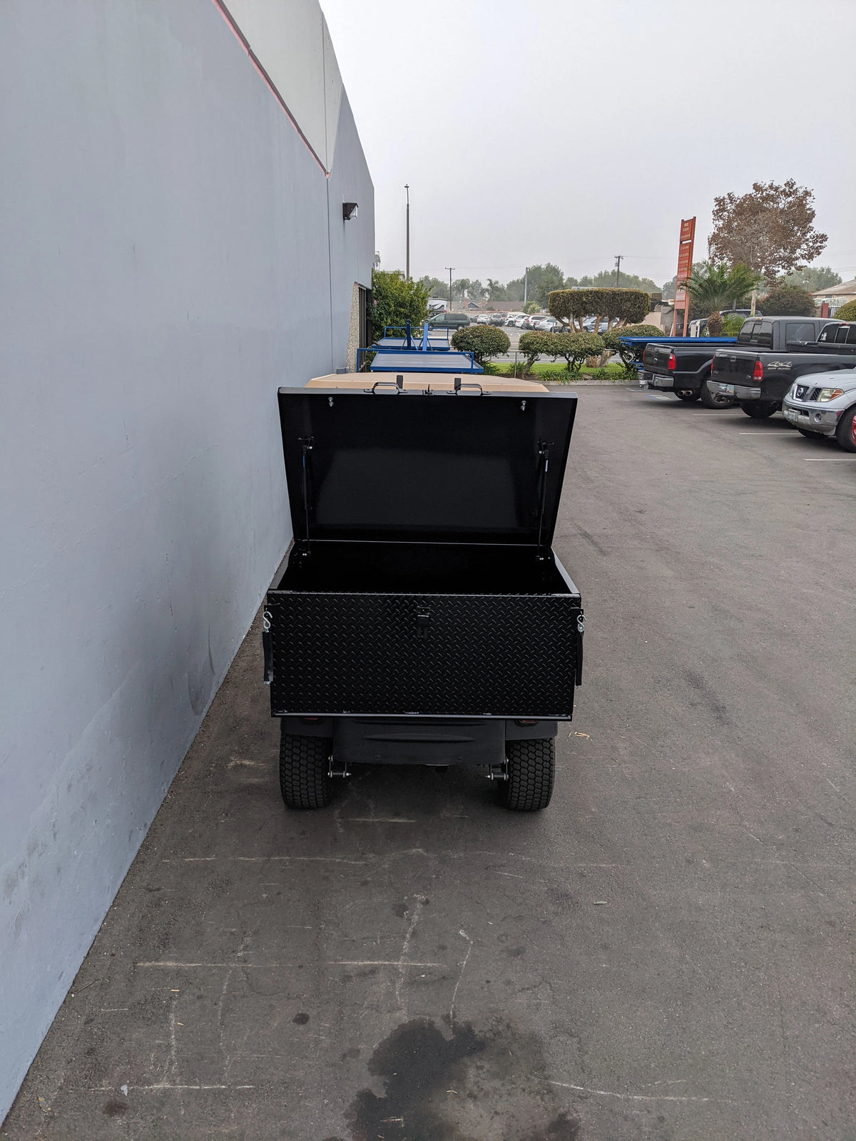 CUSH-800-CARGO31-GS HEAVY DUTY LOCKING CARGO BOX FOR CUSHMAN 800 SERIES open on a golf cart, custom fabrication for golf carts, designed for secure cargo and utility storage.