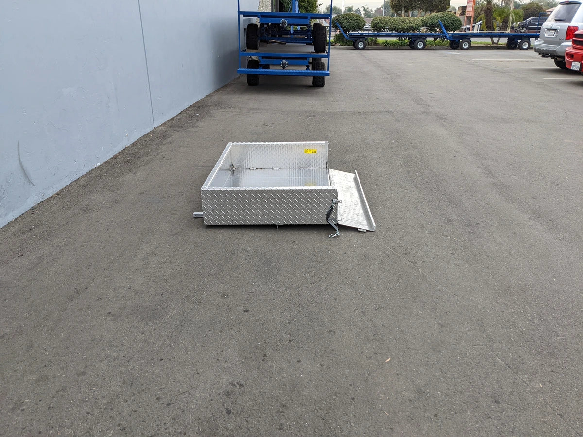 EZGO-RXV-UTIL31A EZ GO RXV ALUMINUM DIAMOND PLATE UTILITY BOX custom fabricated for golf carts, shown open on pavement with diamond plate aluminum construction and secure latching mechanism.