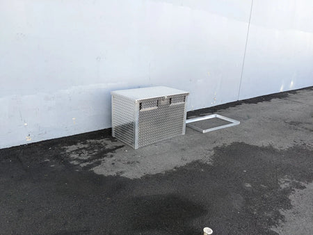 TB-40X24X28-2AD-ABF Aluminum Toolbox with a diamond plate design, shown outdoors on asphalt, custom fabrication for golf carts, suitable for cargo and utility storage.