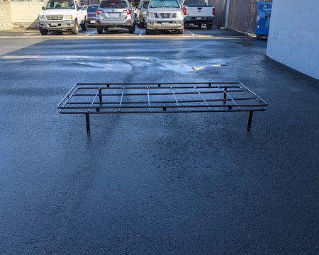 Black metal frame roof rack with multiple crossbars designed for custom fabrication for golf carts, named EAGLE-116INCH-84RR3 EAGLE SHADE TOP ROOF RACK, shown outdoors on asphalt.