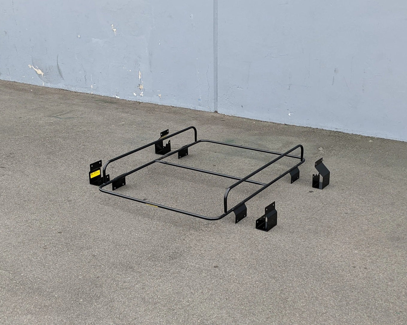 ACG-TSPORT-50LR AMERICAN CUSTOM GOLF CAR T-SPORT LADDER RACK metal frame with mounting brackets designed for securely carrying cargo and accessories on golf carts.
