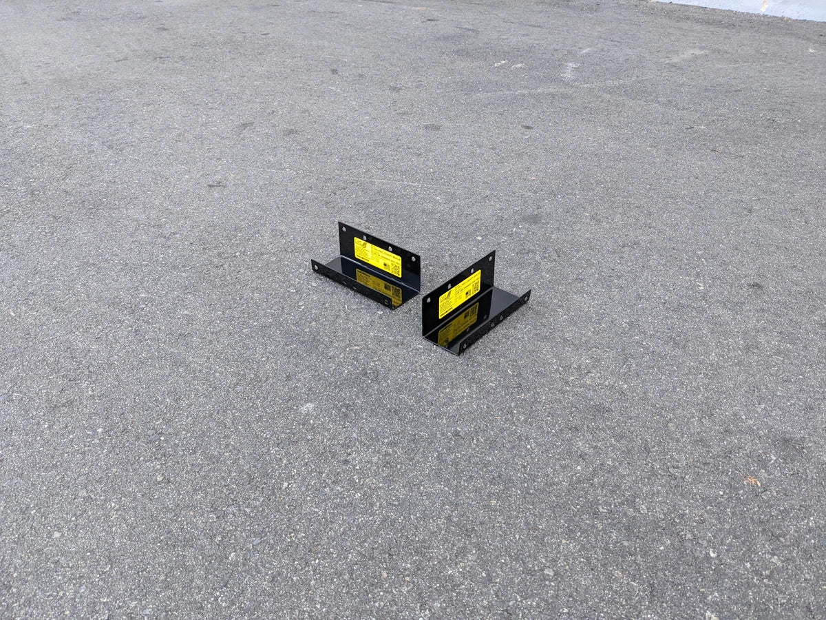 CC-ON+PREC-CANOPY BRACKET SET CLUB CAR ONWARD AND PRECEDENT SHADE TOP CANOPY BRACKET SET displayed on asphalt surface, showing black metal construction with yellow labels.