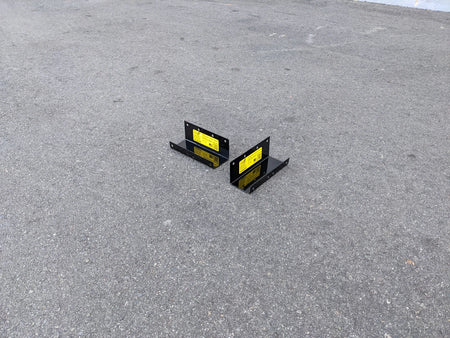CC-ON+PREC-CANOPY BRACKET SET CLUB CAR ONWARD AND PRECEDENT SHADE TOP CANOPY BRACKET SET displayed on asphalt surface, showing black metal construction with yellow labels.