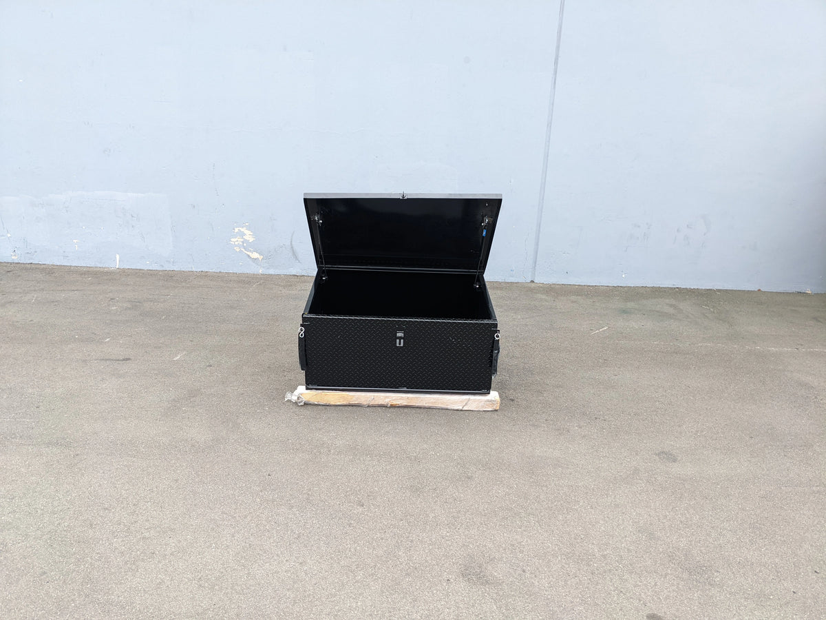 Black utility cargo box with open lid designed for secure storage, featured with CARGO31-GAS-SPRING-RETROFIT GAS SPRING KIT FOR CART HAULERS CARGO BOX LID OPENING AND CLOSING.