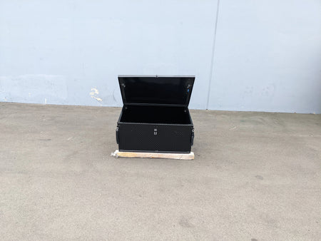 Black utility cargo box with open lid designed for secure storage, featured with CARGO31-GAS-SPRING-RETROFIT GAS SPRING KIT FOR CART HAULERS CARGO BOX LID OPENING AND CLOSING.