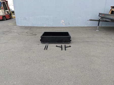 YAM-DRIVE-UTIL31 YAMAHA DRIVE HEAVY-DUTY INDUSTRIAL UTILITY BOX WITH TAILGATE in black metal with custom fabrication for golf carts, shown with mounting brackets on concrete surface.