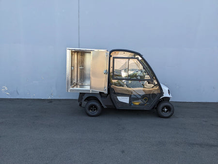 CUSH-HP-CARGO42X48X42-4D CUSHMAN HAULER PRO WITH CAB CARGO BOX WITH LOCKING DOORS custom fabrication for golf carts featuring a secured aluminum utility cargo box and enclosed cabin.