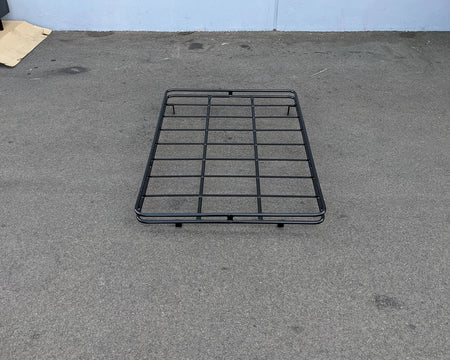 Black metal EZGO-LIBERTY-64RR3 EZ GO LIBERTY ROOF RACK designed for custom fabrication on golf carts, featuring durable bars for cargo and utility carrying capacity.