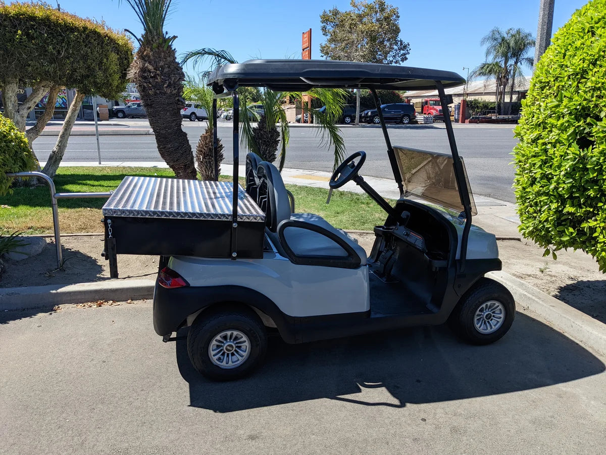 Golf cart featuring UTIL31-LID RETROFIT LOCKING LID FOR CART HAULERS UTILITY BOXES custom fabrication, designed for secure cargo transport with utility box and locking lid.
