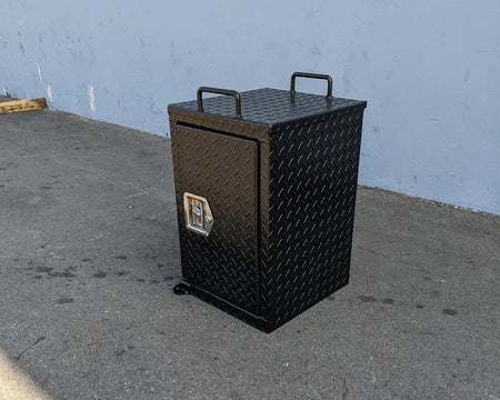 TB-15.5X16X20 LOCKING STORAGE BOX with handles in black diamond plate metal, designed as a custom fabrication for golf carts offering secure cargo storage and easy transport.