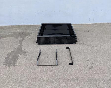TOM-E2-UTIL48 TOMBERLIN EMERGE 2 Utility Box 48″ long shown with custom fabrication parts for golf carts, featuring a durable black metal cargo utility box and mounting brackets.