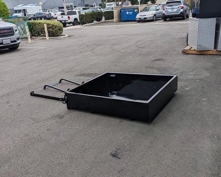 TOM-E2-UTIL48 TOMBERLIN EMERGE 2 Utility Box 48″ long flat black metal utility box with hitch attachment, designed for custom fabrication for golf carts and cargo hauling.