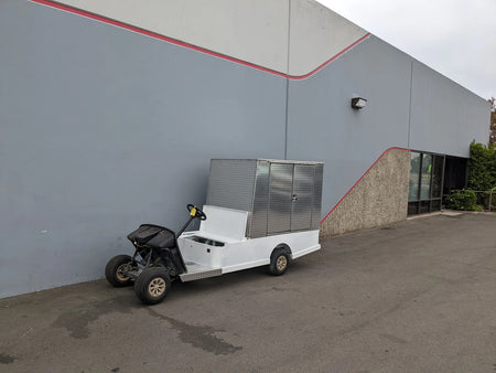 Custom fabricated golf cart with FMB-44X72X48-D-D2W0 FLATBED ALUMINUM DIAMOND PLATE MULTI-PURPOSE BOX mounted for cargo and utility use.