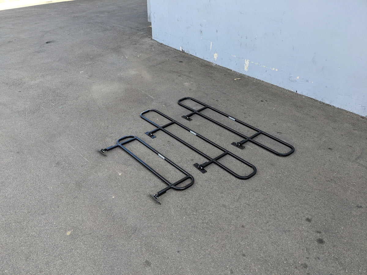 DROP RAILS CUSH-TITAN CUSHMAN TITAN DROP RAILS SET WITH BRACKETS displayed on pavement, custom fabrication for golf carts, designed for utility and durability.