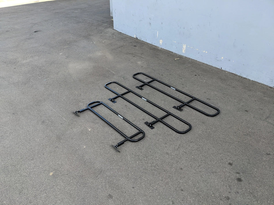 DROP RAILS CUSH-TITAN CUSHMAN TITAN DROP RAILS SET WITH BRACKETS displayed on pavement, custom fabrication for golf carts, designed for utility and durability.