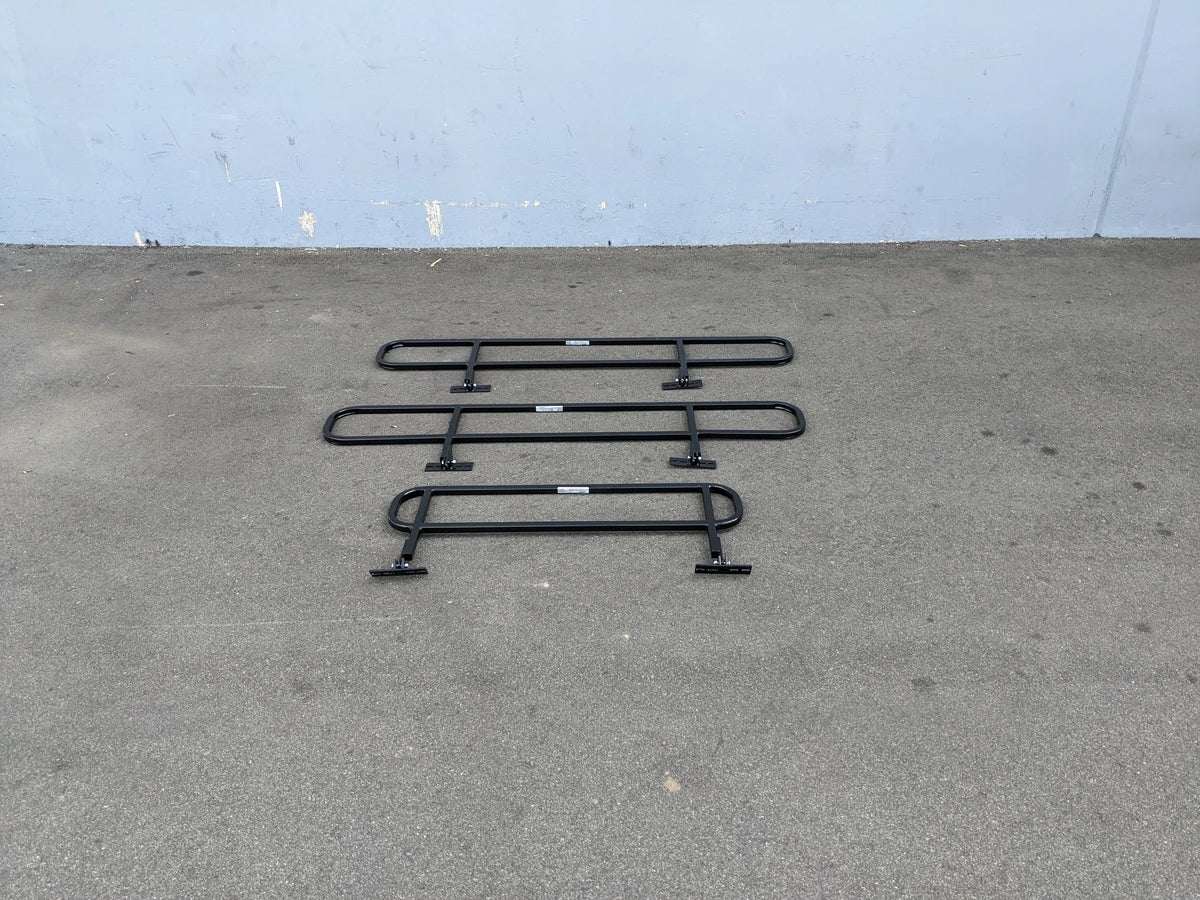DROP RAILS CUSH-TITAN CUSHMAN TITAN DROP RAILS SET WITH BRACKETS displayed on pavement, custom fabrication for golf carts, designed for carrying cargo and utility boxes.