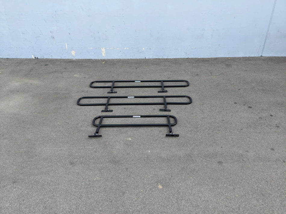 DROP RAILS CUSH-TITAN CUSHMAN TITAN DROP RAILS SET WITH BRACKETS displayed on pavement, custom fabrication for golf carts, designed for carrying cargo and utility boxes.