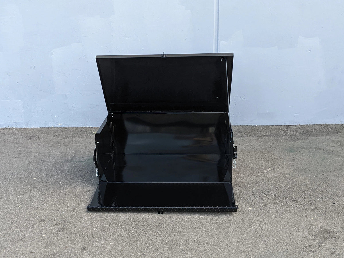 Open black metal utility box designed for secure storage showing the inside with hinged locking lid for deck mounting, labeled as CARGO24-SKIDS CARGO BOX WITH LOCKING LID FOR DECK MOUNTING