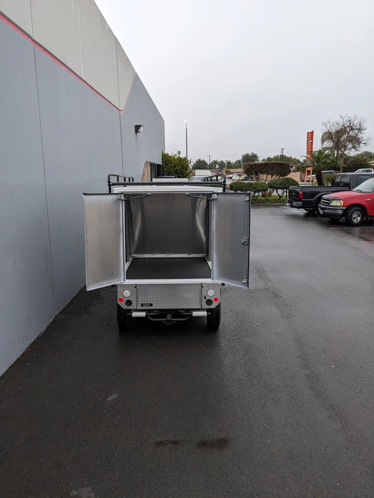 FMB-GEM-52X70X48-S-D3W0 ROLL UP DOORS FLATBED ALUMINUM SMOOTH MULTI-PURPOSE BOX FOR GEM ELXD 52 WIDE X 70 LONG X 48 TALL open rear view showing spacious cargo area, custom fabrication for golf carts.