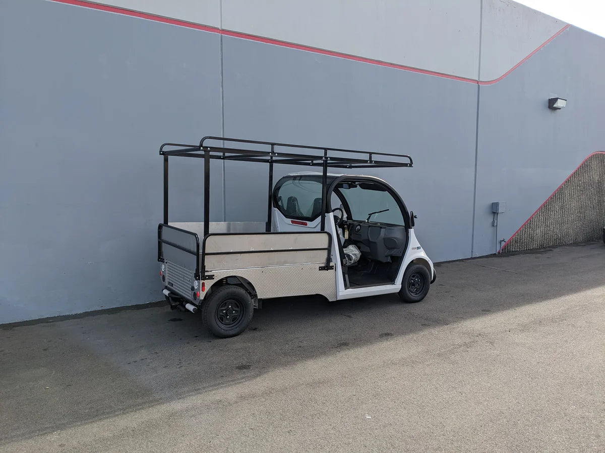 GEM-ELXD-53X120-IN-TLR Top Mount Ladder Rack for mounting inside the bed of a GEM ELXD golf cart with custom fabrication, featuring a sturdy black metal frame designed for cargo and ladder transport.