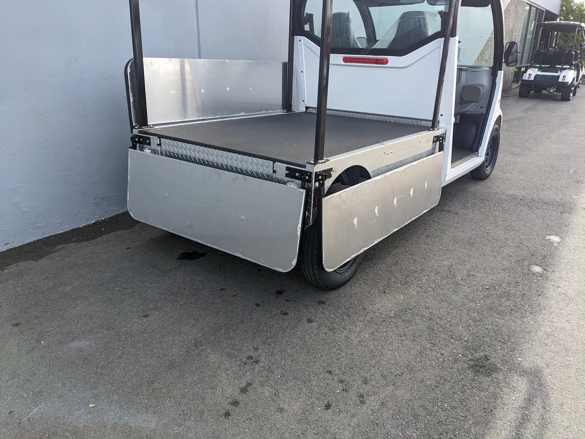 Custom fabricated DROP RAILS GEM ELXD SOL SOLID SIDE RAILS FOR GEM ELXD installed on a golf cart, designed for durability and utility in cargo and specialty golf cart beds.