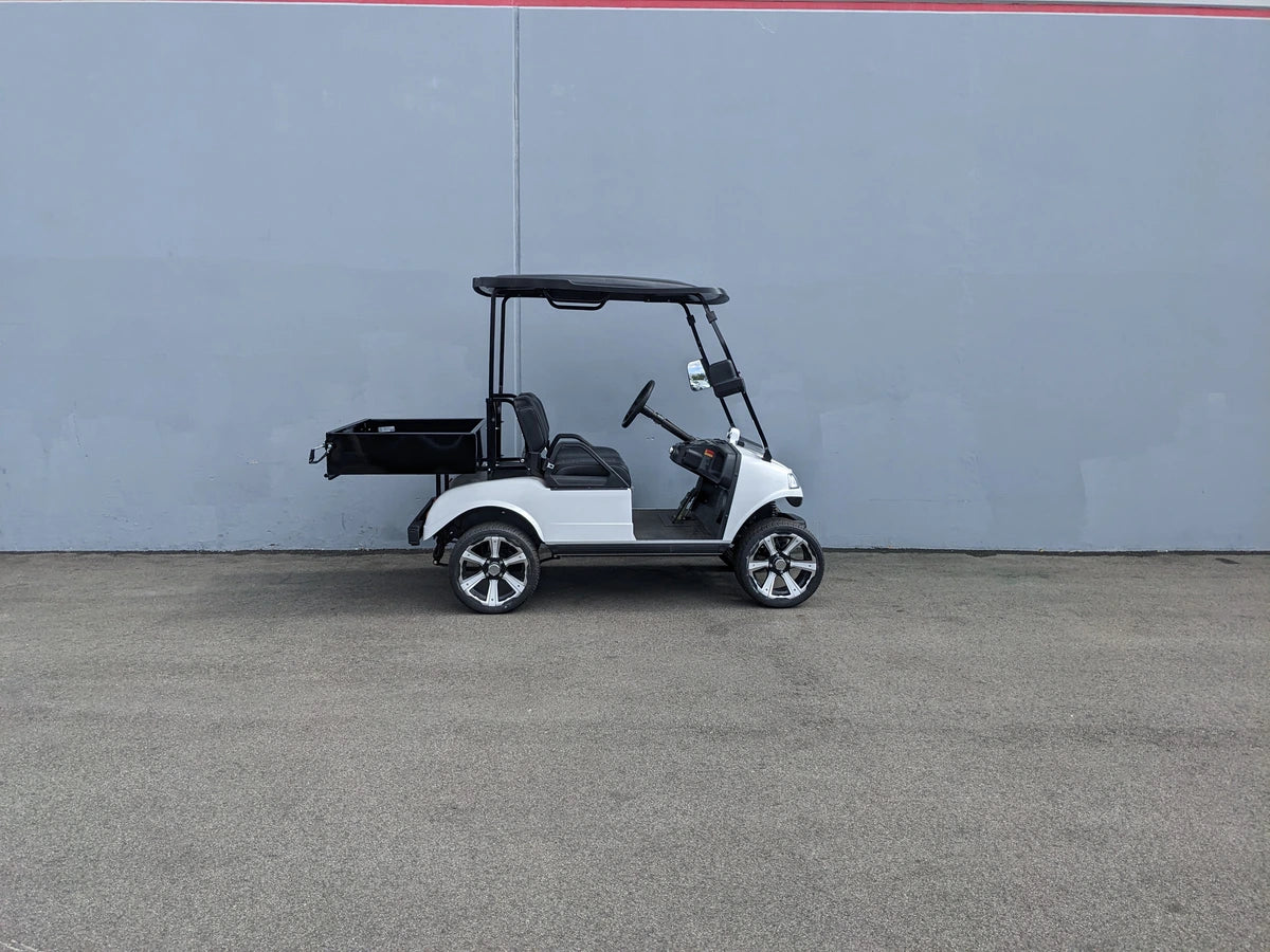 White golf cart equipped with a black EVO-CLASSIC-UTIL31 EVOLUTION CLASSIC HEAVY-DUTY UTILITY BOX mounted at the rear, designed for custom fabrication for golf carts.