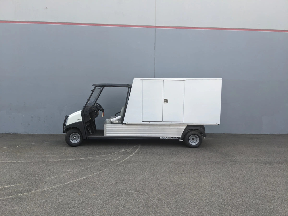 A utility flatbed cart equipped with the CC-CARRYALL900-LAUNDRY BOX FLATBED SPECIFIC PURPOSE BOX FOR CARRYALL 900 WITH LOCKING DOORS, SHELVES, AND HANGING ROD, designed for secure cargo and storage.