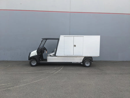 A utility flatbed cart equipped with the CC-CARRYALL900-LAUNDRY BOX FLATBED SPECIFIC PURPOSE BOX FOR CARRYALL 900 WITH LOCKING DOORS, SHELVES, AND HANGING ROD, designed for secure cargo and storage.
