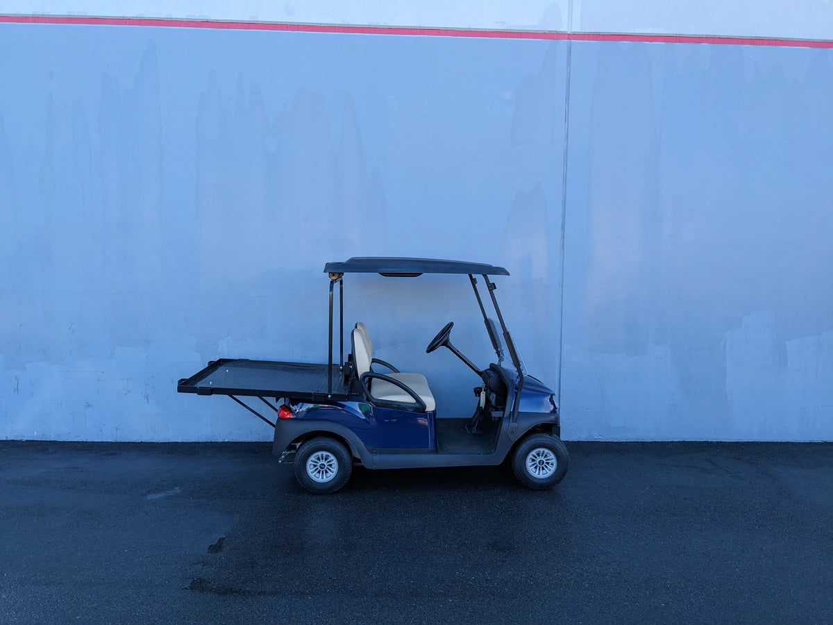 Golf cart equipped with CC-PREC-DECK48X48 SMALL FLATBED DECK for enhanced cargo and utility transport, ideal for outdoor and specialty golf cart accessory needs.