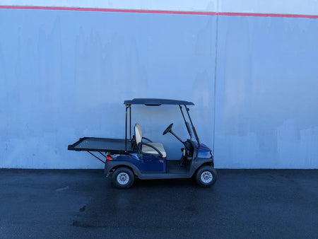 Golf cart equipped with CC-PREC-DECK48X48 SMALL FLATBED DECK for enhanced cargo and utility transport, ideal for outdoor and specialty golf cart accessory needs.