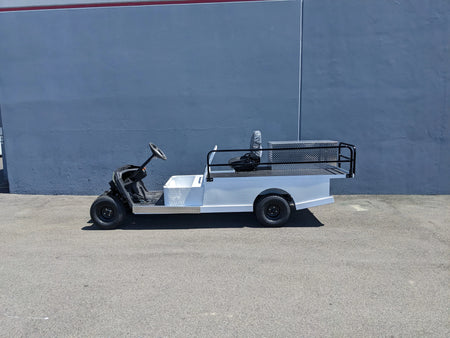 YAM-AMB-2SEAT-ST-FLAT-84 2Seat Ambulance Conversion on Yamaha Flatbed shown in white with custom fabrication for golf carts, featuring flatbed cargo area and utility railing.