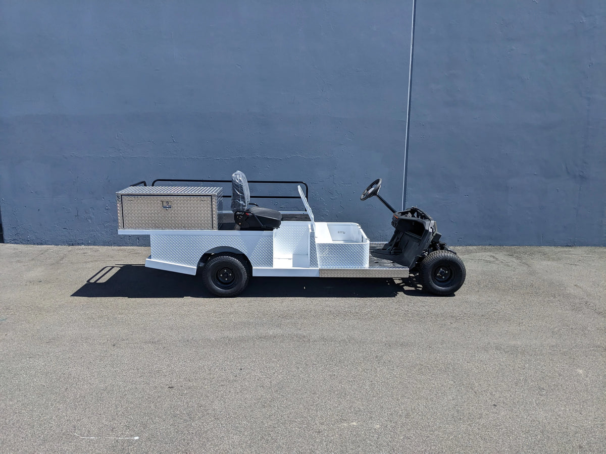 YAM-AMB-2SEAT-ST-FLAT-84 2Seat Ambulance Conversion on Yamaha Flatbed showing a custom fabrication for golf carts with a flatbed, storage box, and seating designed for utility and medical transport.