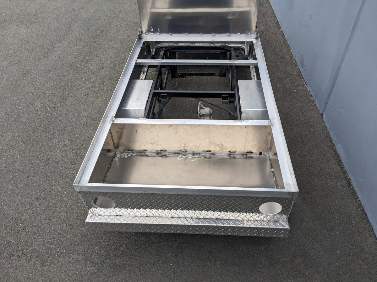 EZGO-TXT-AL-FLAT-72 6 FOOT ALUMINUM BED FLATBED CONVERSION showing custom fabrication for golf carts with an aluminum flatbed base and structural framework for cargo and utility use.