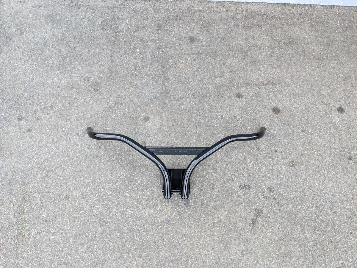 CRUISE-C40-BG CRUISE CAR/ICO C40 BRUSH GUARD, a custom fabricated black metal brush guard designed for golf carts, shown on concrete surface.