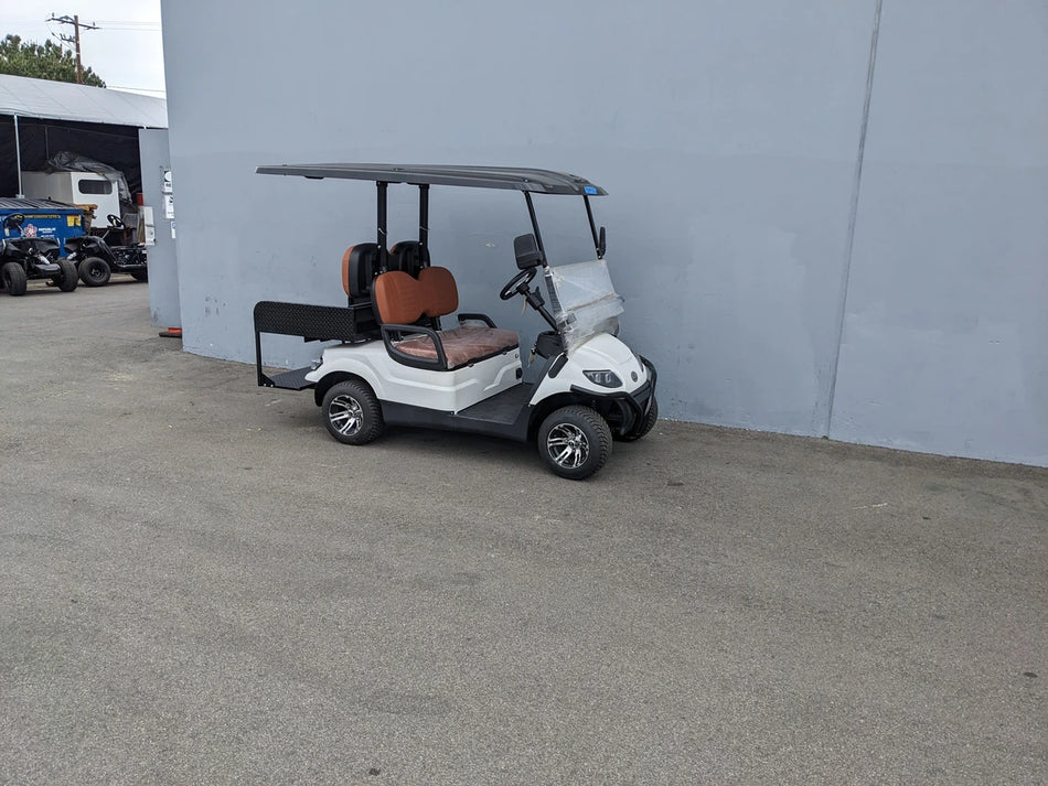 CRUISE-C40-BG CRUISE CAR/ICO C40 BRUSH GUARD installed on a white golf cart with brown seats, showcasing custom fabrication for golf carts and designed for enhanced protection and utility.