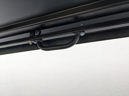 GRAB HANDLE 7″ multi-purpose heavy-duty bolt-on handle mounted inside a golf cart custom fabricated for secure grip and support during transport or utility use.