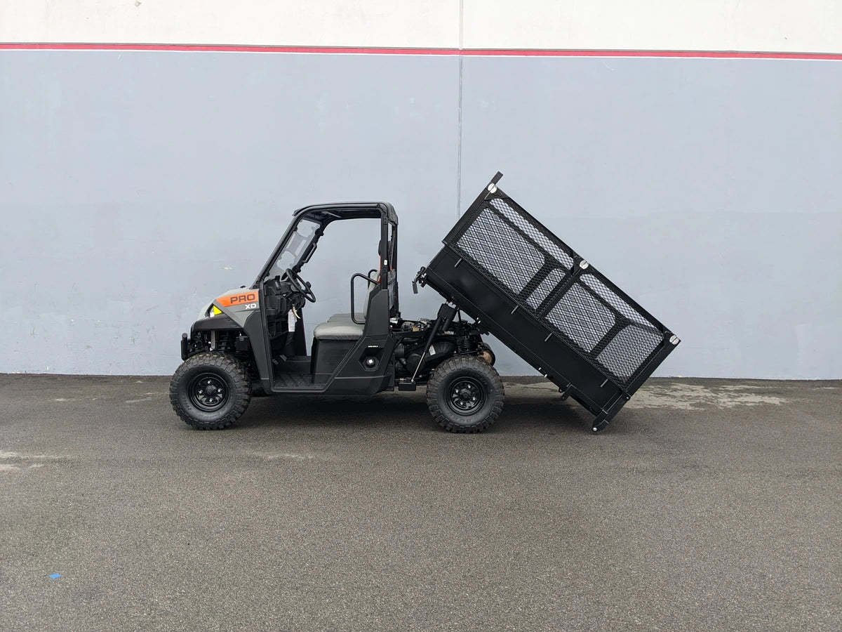 Off-road utility vehicle equipped with FB-POL-PROXD-54X76X11-DUMP TILT BED ACTUATOR WITH KEY FOB REMOTE, showcasing custom fabrication for golf carts and specialty golf cart beds.