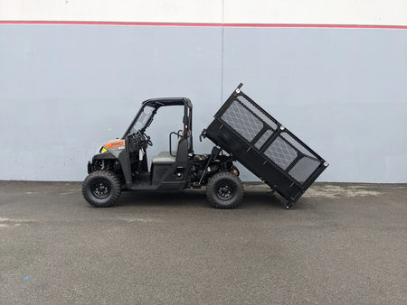 Off-road utility vehicle equipped with FB-POL-PROXD-54X76X11-DUMP TILT BED ACTUATOR WITH KEY FOB REMOTE, showcasing custom fabrication for golf carts and specialty golf cart beds.