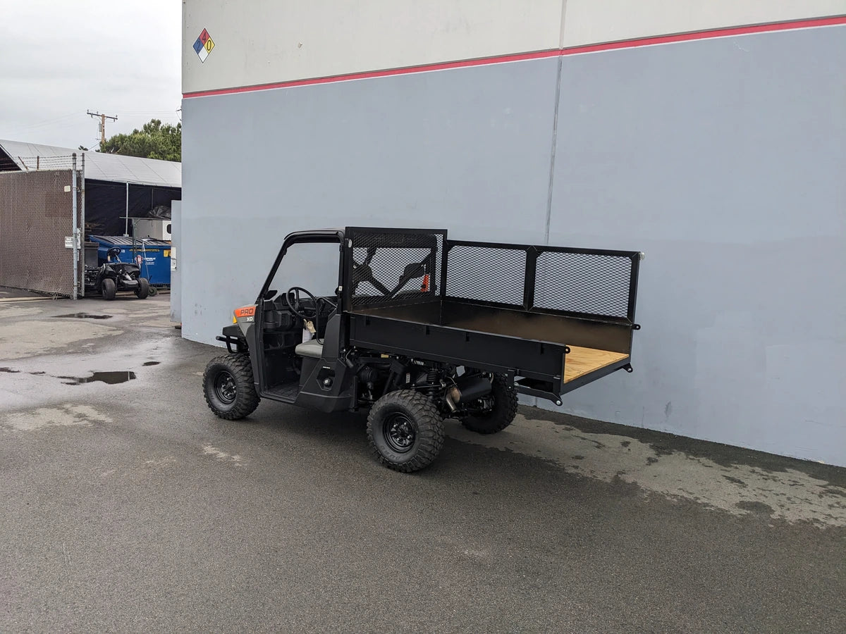 Utility golf cart equipped with FB-POL-PROXD-54X76X11-STAKE-OCB POLARIS STAKEBED RETROFIT featuring a custom flatbed with mesh side panels designed for cargo and utility hauling.