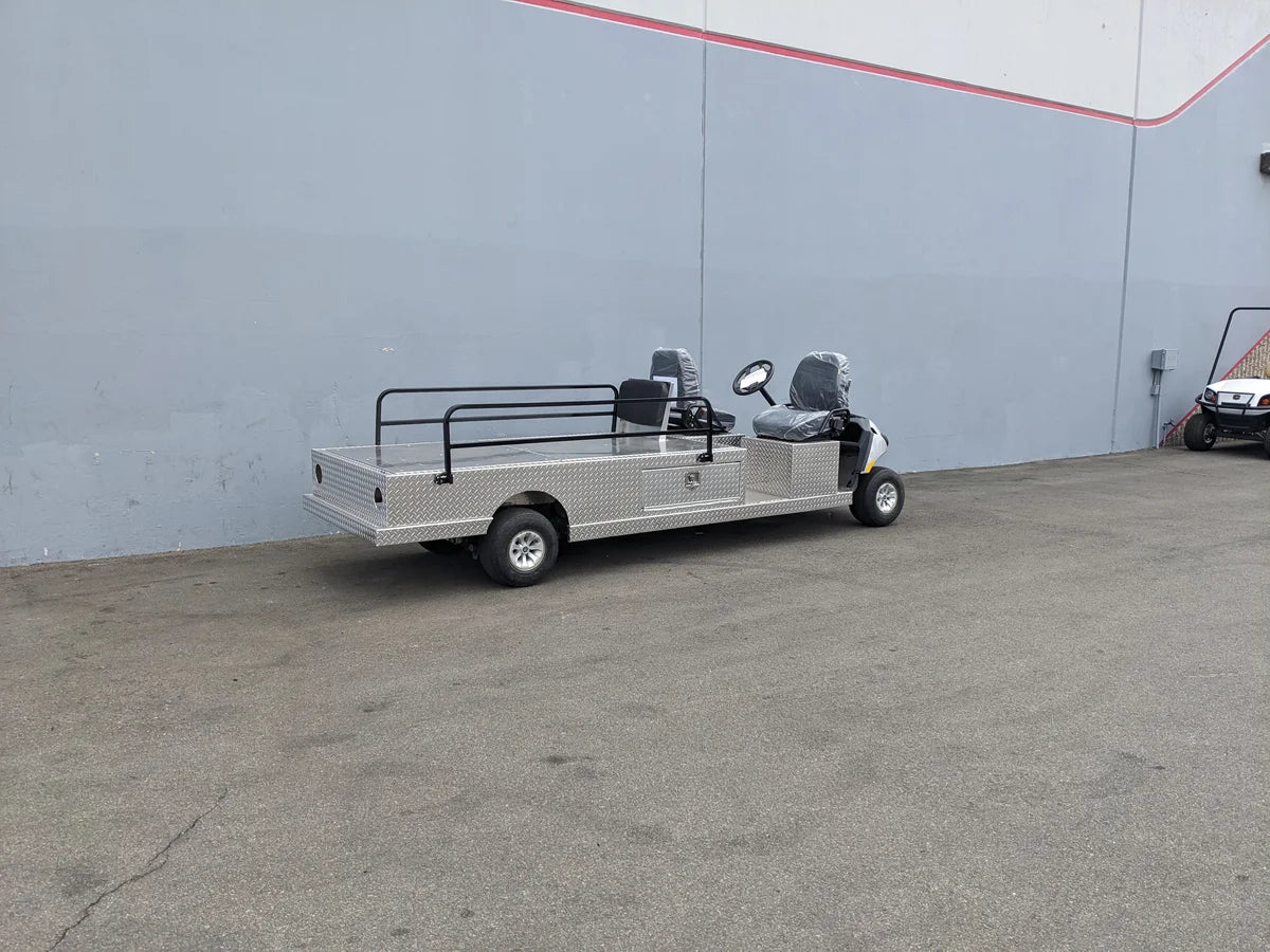 YAM-AMB-2SEAT-REAREMT-96X23 AMBULANCE CART, a custom fabrication for golf carts with a flatbed utility box and rear safety rails, designed for specialty ambulance and wheelchair transport use.