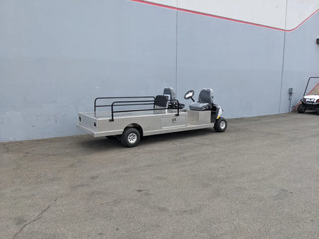 YAM-AMB-2SEAT-REAREMT-96X23 AMBULANCE CART, a custom fabrication for golf carts with a flatbed utility box and rear safety rails, designed for specialty ambulance and wheelchair transport use.