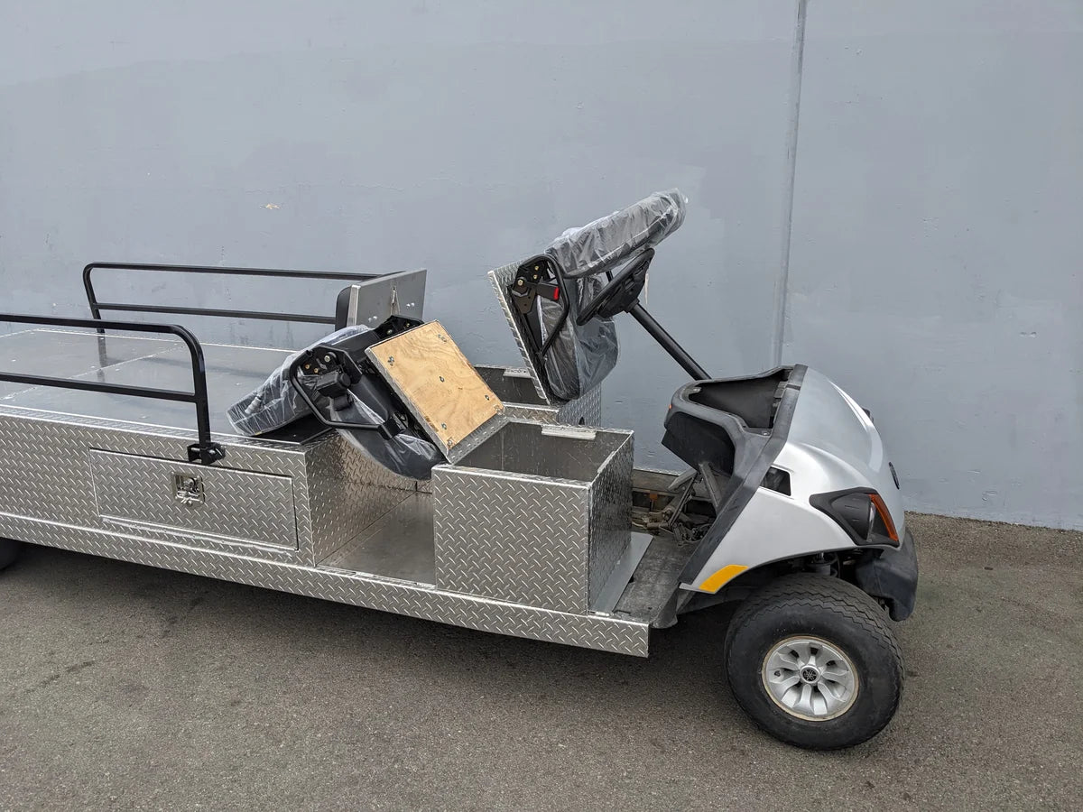 YAM-AMB-2SEAT-REAREMT-96X23 AMBULANCE CART featuring custom fabrication for golf carts with two rear seats, diamond plate metal storage compartments, and a white front body.