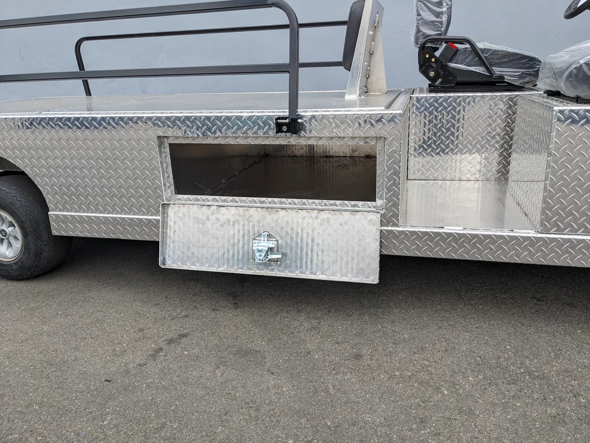 Close-up of the diamond plate metal storage compartment on the YAM-AMB-2SEAT-REAREMT-96X23 AMBULANCE CART, custom fabricated for golf carts with a hinged lockable door.