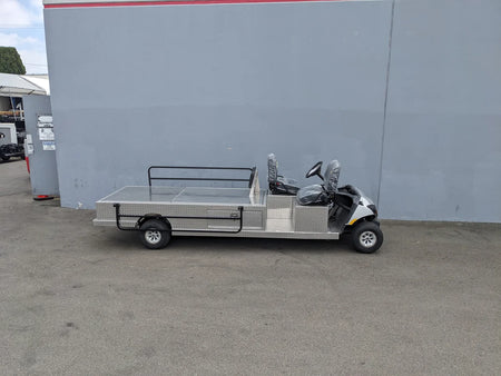 White utility cart with metal flatbed and rear seating, designed for specialized use, custom fabrication for golf carts, YAM-AMB-2SEAT-REAREMT-96X23 AMBULANCE CART.