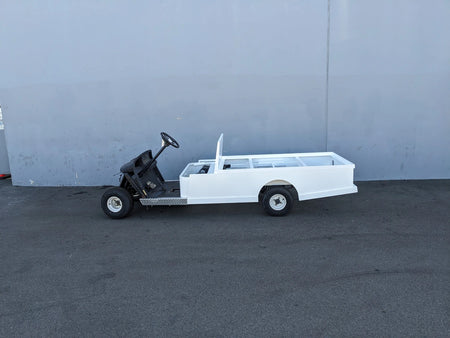 EZGO-TXT-ST-FLAT-72 6 FT FLATBED CONVERSION FOR EZ GO TXT shown in white with custom fabrication for golf carts, featuring a flatbed design ideal for cargo and utility use.