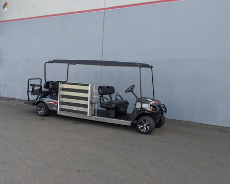Golf cart with custom fabrications designed for CUSH-WHEELCHAIR-TRANSPORT CUSHMAN GOLF CART CONVERSIONS FOR WHEELCHAIR PASSENGER, featuring wheelchair transport and seating modifications.