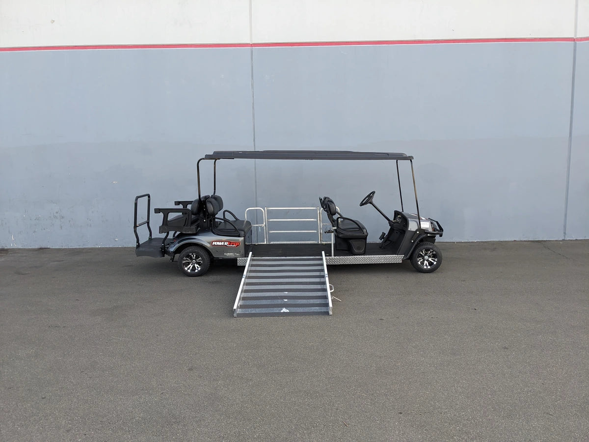 Golf cart modified with ramp and seating for wheelchair access, showcasing custom fabrication for golf carts and CUSH-WHEELCHAIR-TRANSPORT CUSHMAN GOLF CART CONVERSIONS FOR WHEELCHAIR PASSENGER.