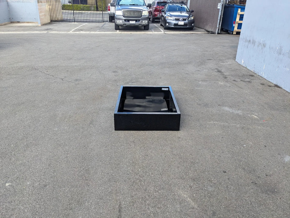 Black removable utility box insert placed on asphalt, designed for golf cart customization, ICON-I40-RUB31-40WIDE Removable Utility Box Insert for Icon I40 Flip-Seat, showcasing durable custom fabrication for golf carts.