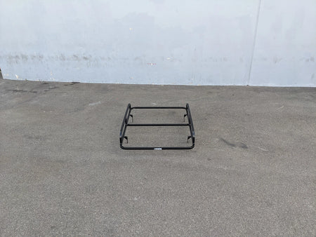 EZGO-TXT14+VLRCHP-54LR EZ GO TXT 2014 AND NEWER, VALOR, CUSHMAN HAULER PRO HEAVY-DUTY LADDER RACK flat black custom fabrication for golf carts shown on pavement against gray wall background.